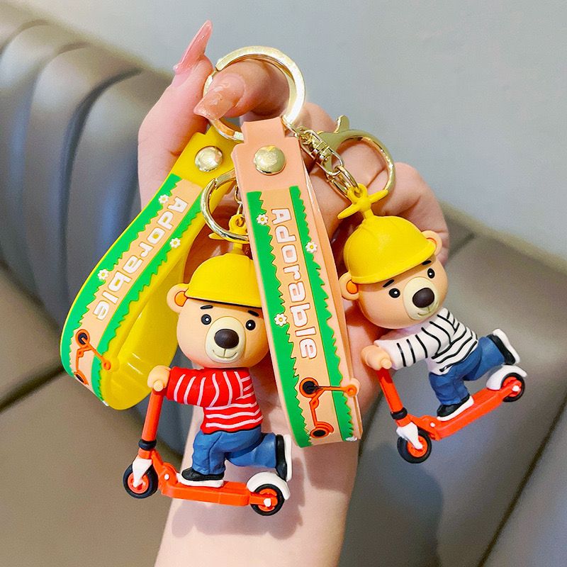Adorable Bear on Scooter Rubber Keychain with Wrist Strap – 3D Soft PVC Figure, Gold Ring + Clasp