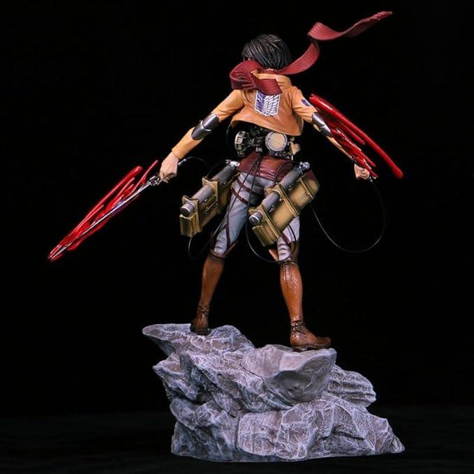 Anime collectible figure in scout uniform with red swords, standing on rock base