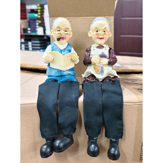 Elderly Couple Resin Figurines – Dada Reading Book & Dadi Knitting Basket, Sitting Dolls (Pair)
