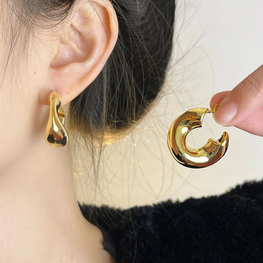 C-Shaped Golden Hoop Earrings – Minimal Chunky Circle Design