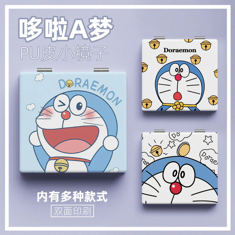 Three Doraemon-themed compact mirrors on a purple background
