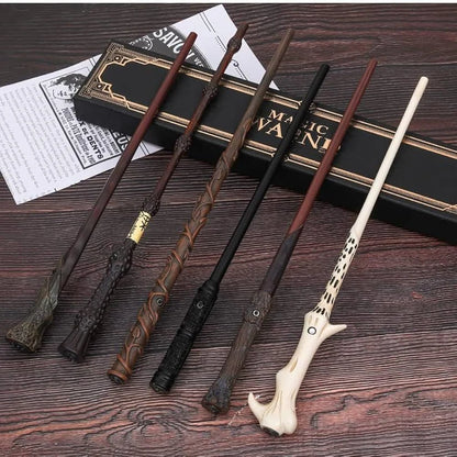 Set of decorative wands on a wooden surface with a box labeled 'MAGIC WAND' in the background.