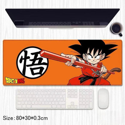 Dragon Ball Goku large orange mouse pad with cartoon character and keyboard setup