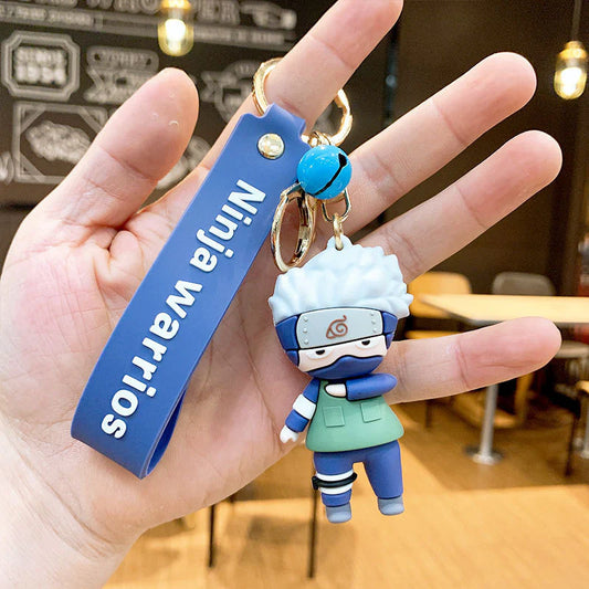 Kakashi Rubber Keychain with Blue Strap & Bell – 3D Ninja Figure, Gold Ring + Clasp
