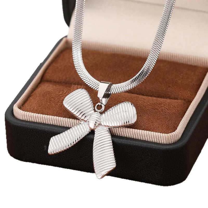Silver Bow Statement Necklace – Elegant Ribbon Pendant Chain Jewelry