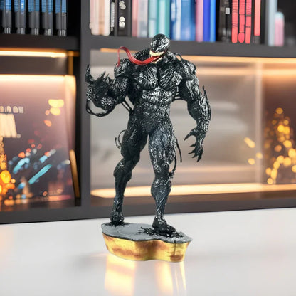 Venom action figure with extended tongue displayed on desk in modern bookshelf setting