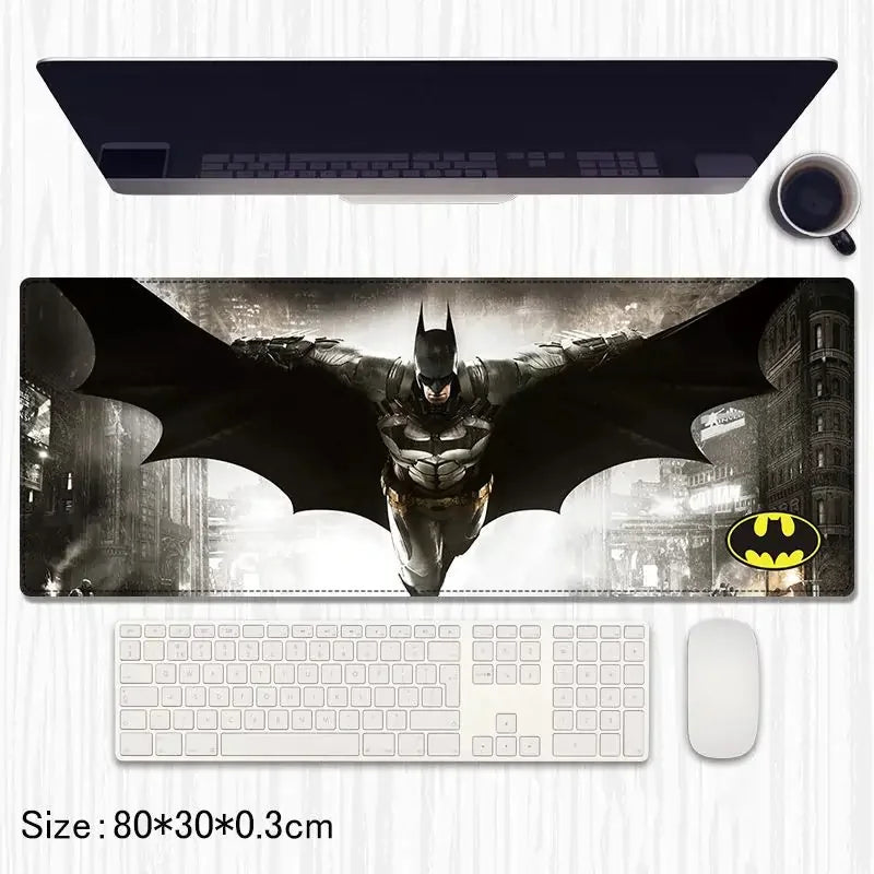 Batman flying wings desk mat with Gotham city background, computer setup visible
