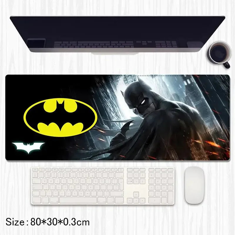 Batman desk mat with yellow Batman logo, dark city background, keyboard and mouse on table