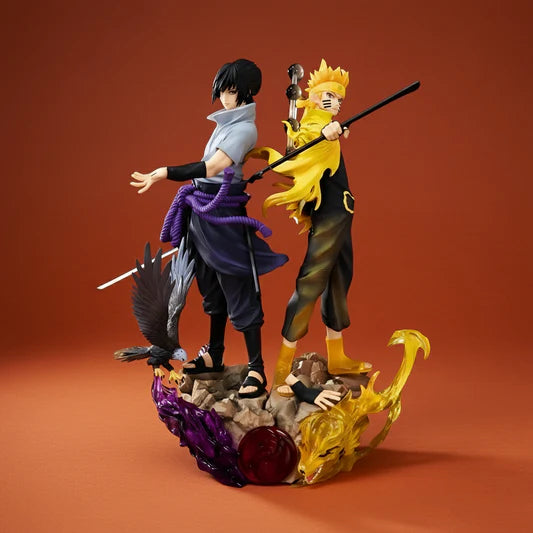 Two animated character figurines on a decorative base with a red background